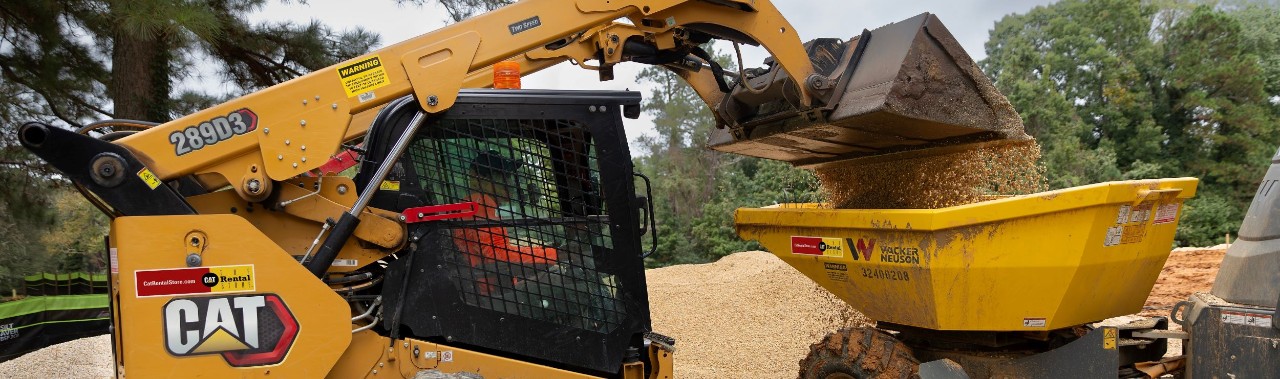 Compact Track Loader loading up a small trailer