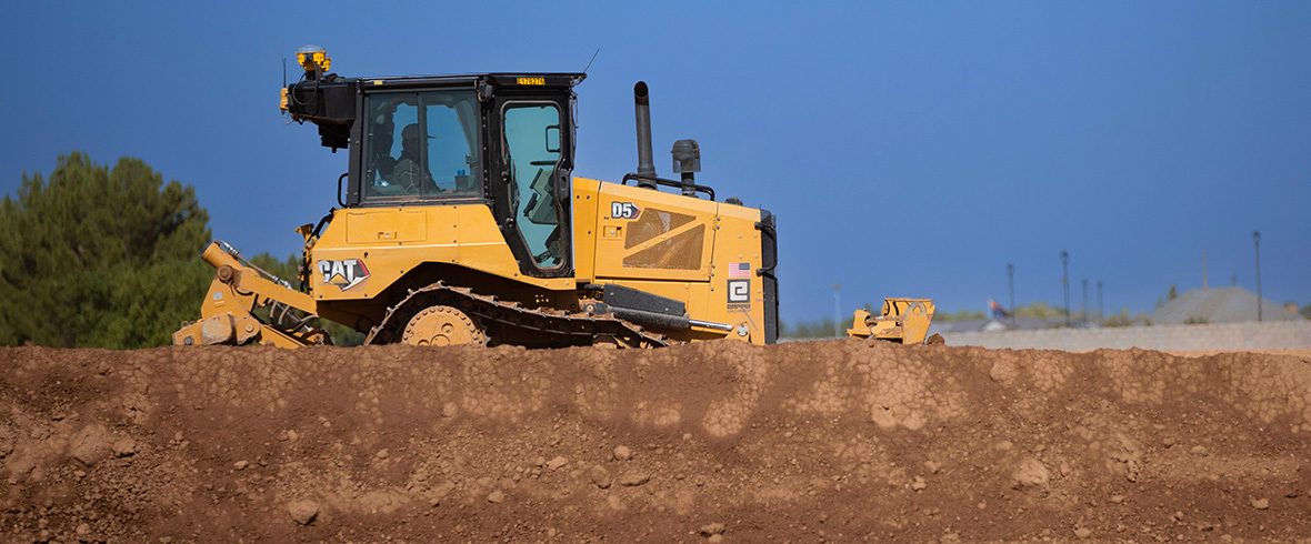 Cat dozer at worksite with antennas