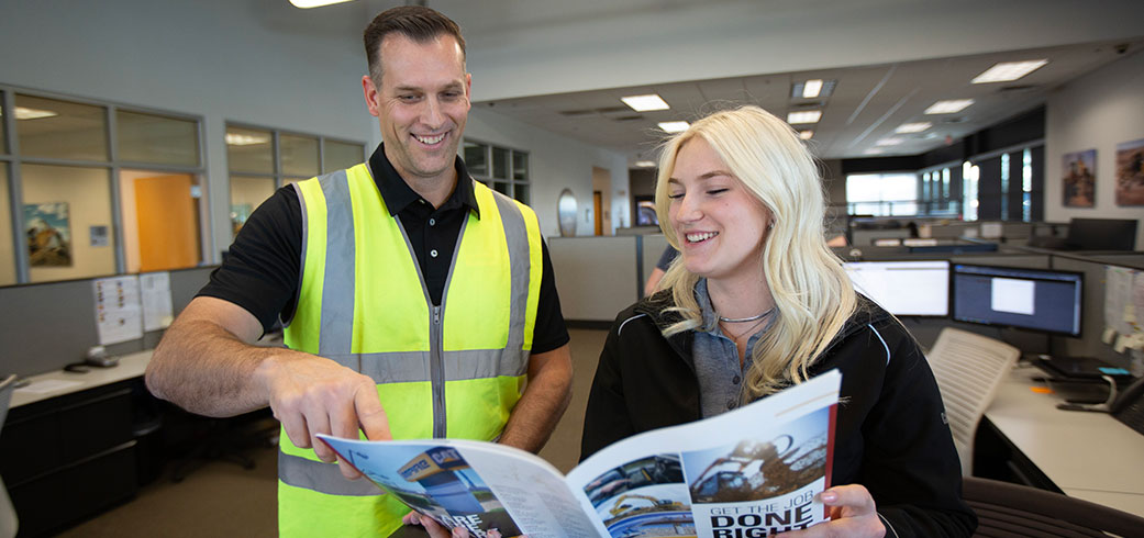 rental support employees reviewing rental brochure